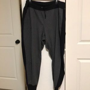Grey and black sweat pants.